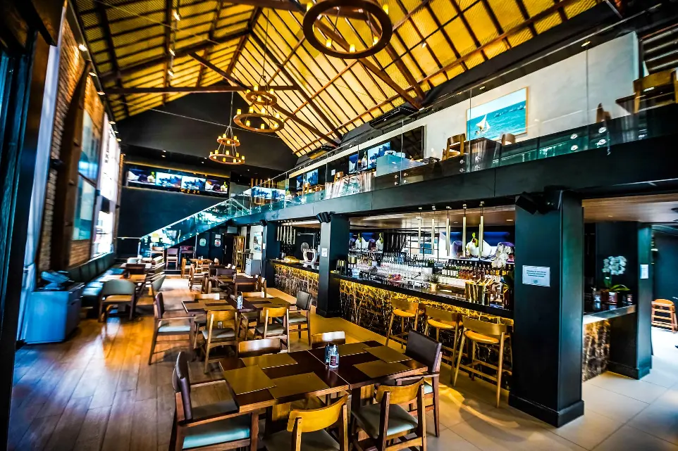 Warm tropical dining room at Coco Bambu Beira Mar in Fortaleza