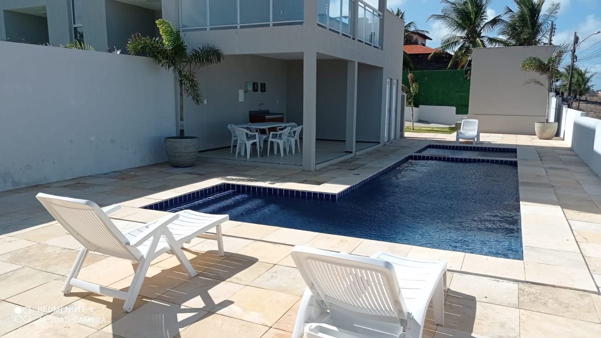 Shared swimming pool and leisure deck at Beach Townhouse IV