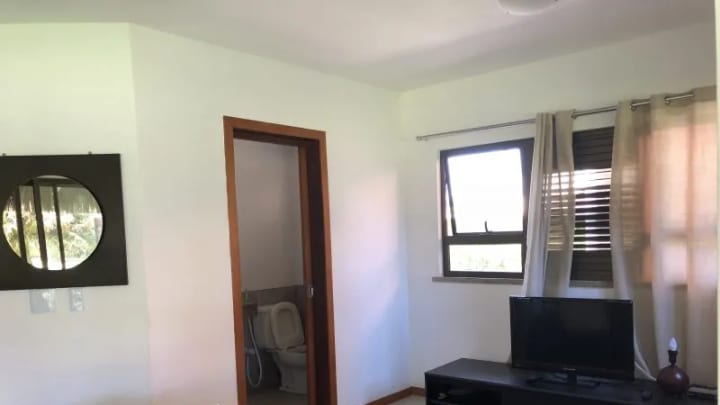 Living room with television and access to the bedrooms
